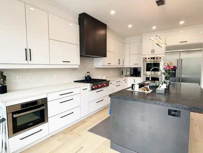 Kitchen renovation cost toronto with modern white cabinets and stainless steel appliances by Razco Renovation