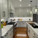 Modern white kitchen renovation in a Richmond Hill condo by Razco Renovation.