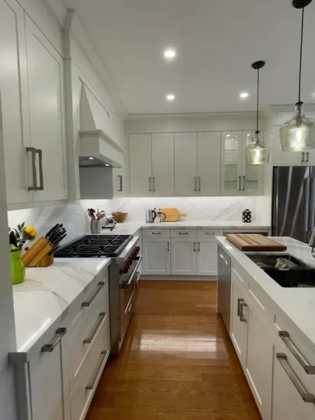 Modern white kitchen renovation in a Richmond Hill condo by Razco Renovation.