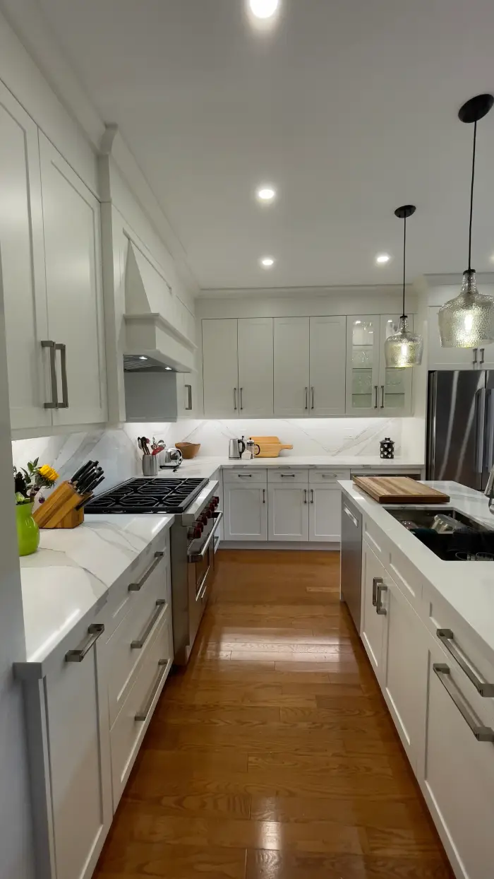 Modern white kitchen renovation in a Richmond Hill condo by Razco Renovation.