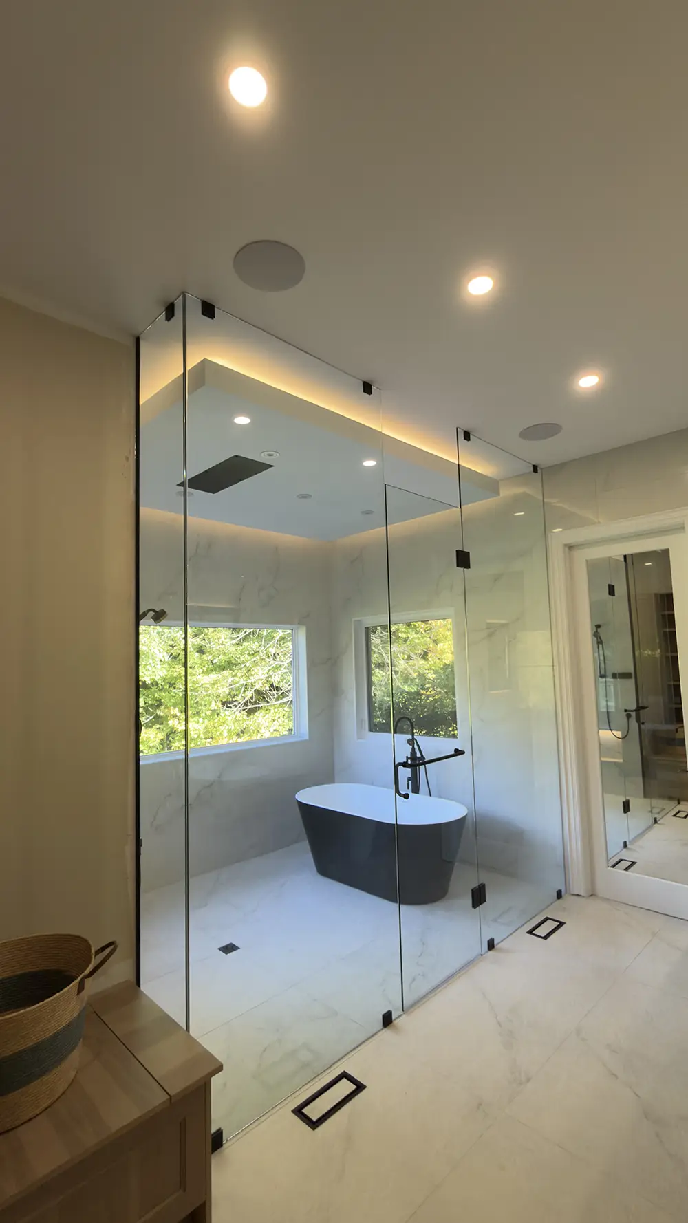 Curbless walk-in shower with ceiling rainfall showerhead and LED lighting – bathroom renovation in Vaughan